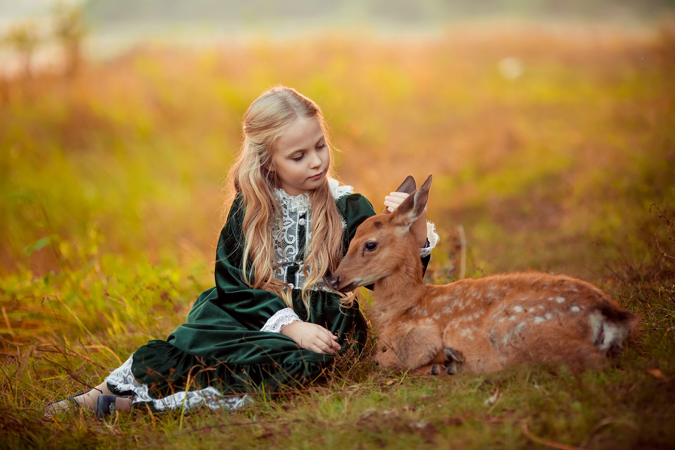 cute-little-blonde-girl-green-vintage-dress-sits-small-sika-deer-around-them-yellow-beautiful-autumn-trees